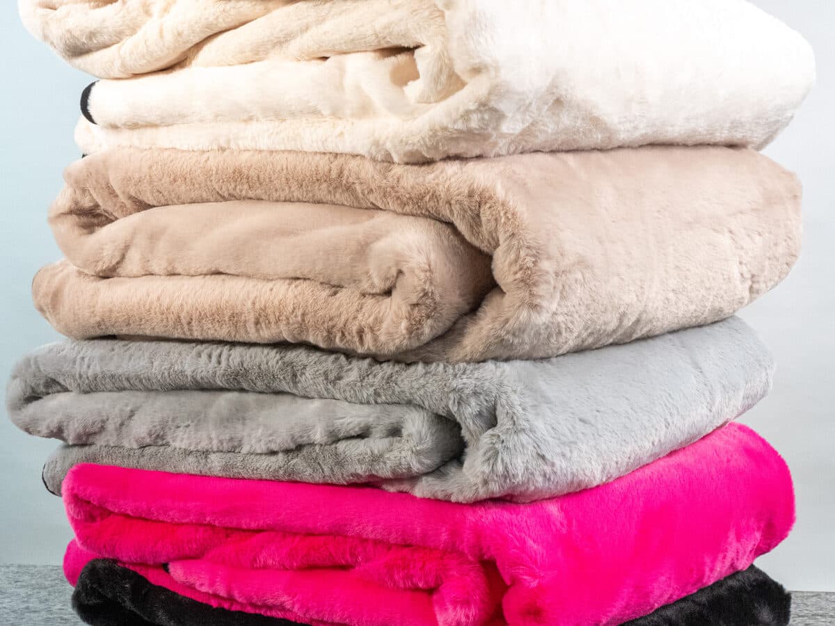 Swanky Blanky showing the printed face folded over the faux-fur back